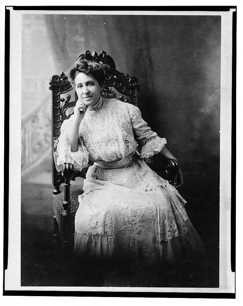 Educator-Activist Mary Church Terrell seated facing the camera in white, victorian attire.