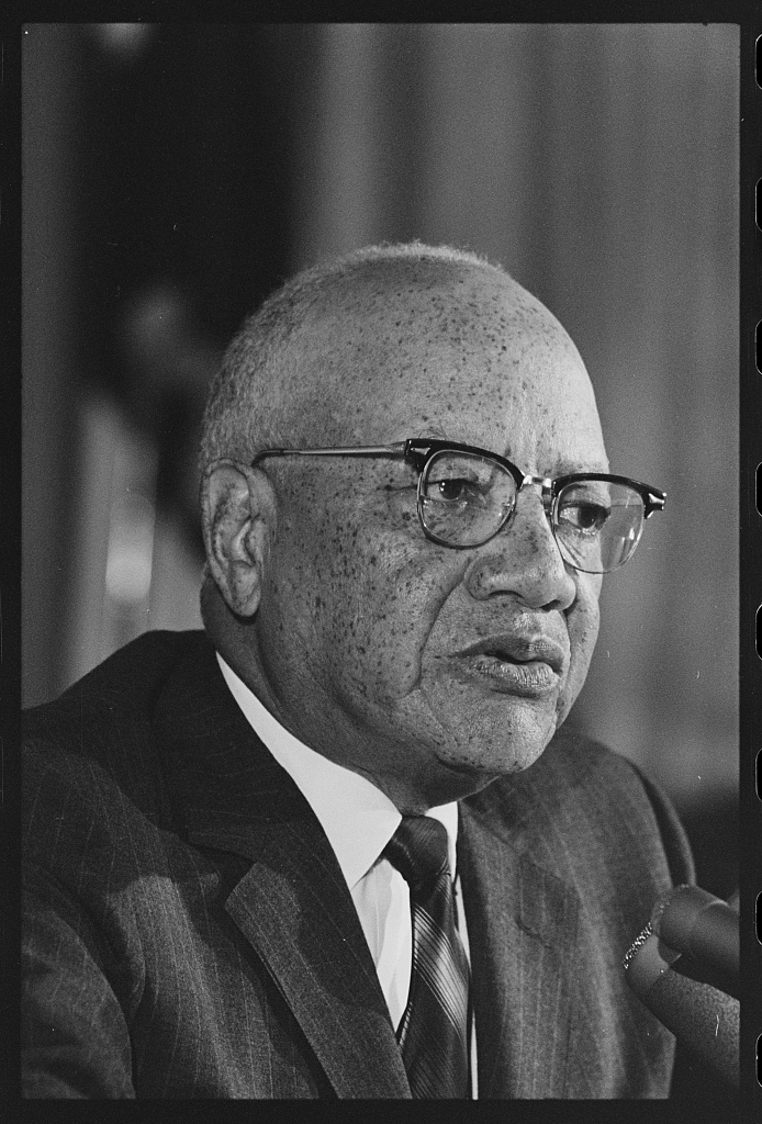 President Nabrit, pictured in suit and glasses, at a 1967 press conference. 