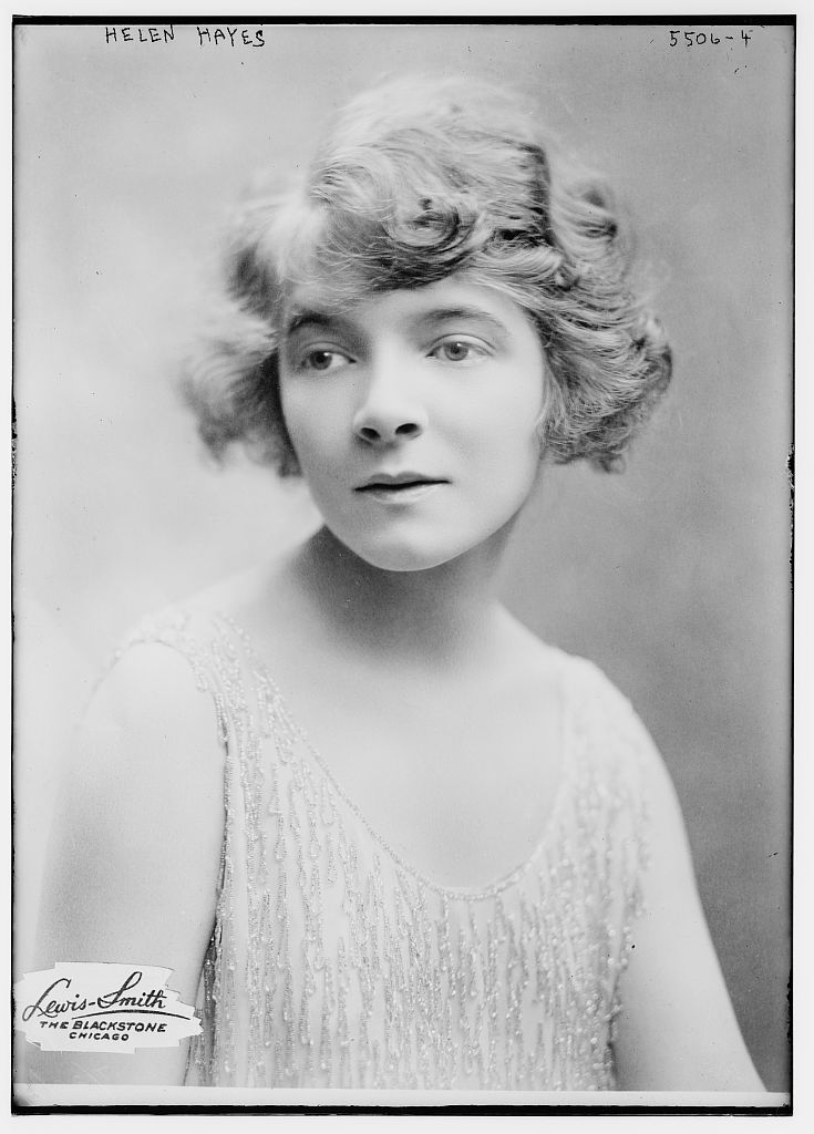 Portrait of young woman in dress.