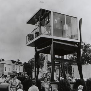 Lynn Arnold waves to onlookers from her glass apartment atop the Big Chair in Anacostia. (Reprinted with permission of the DC Public Library, Star Collection, © Washington Post.)