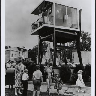 Lynn Arnold waves to onlookers from her glass apartment atop the Big Chair in Anacostia. (Reprinted with permission of the DC Public Library, Star Collection, © Washington Post.)