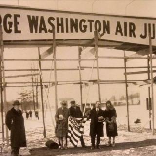 Black and white photo of Henry Woodhouse and guests standing in front of George Washington Air Junction entrance, from 1929-30.