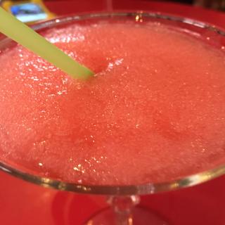 Closeup of red frozen daquiri in glass with straw. (Source: Flickr user vxla, licensed by CC BY-NC 2.0)