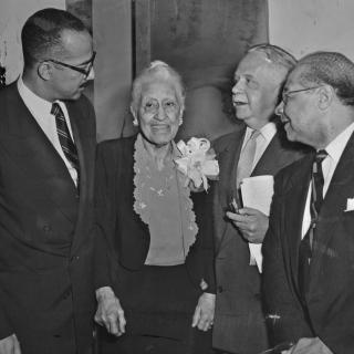 Mary Church Terrell stands with three African American men in 1953. (Reprinted with permission of the DC Public Library, Star Collection, © Washington Post.)
