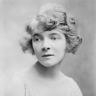 Portrait of young woman in dress.