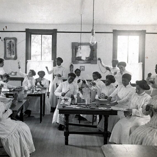 a vocational classroom with students doing various domestic tasks