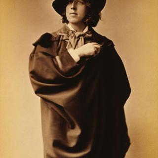 This man knows how to rock a cape. (1882 photograph of Oscar Wilde by Napoleon Sarony. Source: Wikipedia Commons)