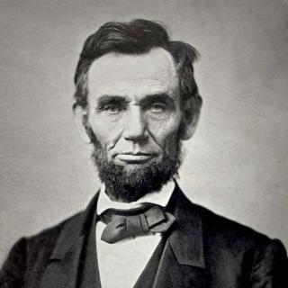 Abraham Lincoln, bearded man wearing suit and bowtie.