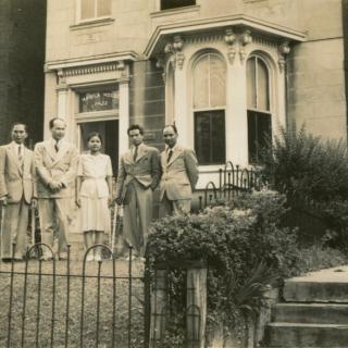 Filipino family in front of a house (Source: University of Maryland Libraries, Special Collections)
