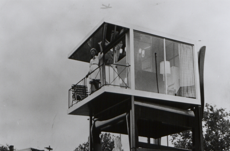 Lynn Arnold waves to onlookers from her glass apartment atop the Big Chair in Anacostia. (Reprinted with permission of the DC Public Library, Star Collection, © Washington Post.)