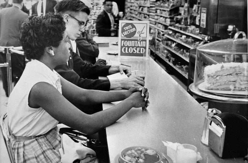 Activists at drug store counter in Arlington. (Source: Washington Area Spark on Flickr.)