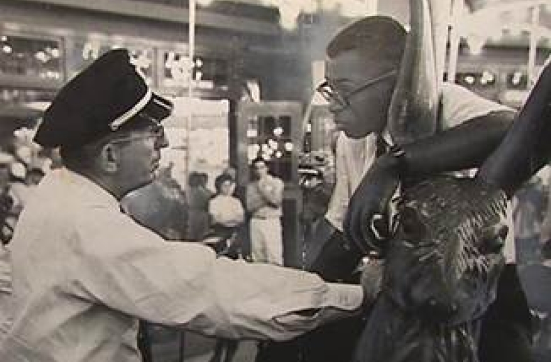 Officer Frank Collins confronts Laurence Henry on Glen Echo's Dentzel Carousel on June 30, 1960. (Photo source: National Park Service)