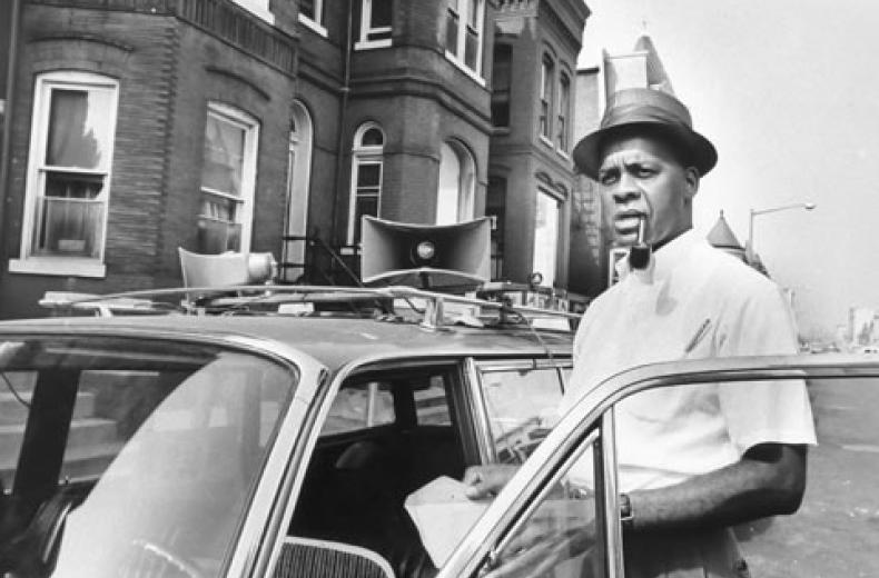 Hobson with his station wagon and trademark pipe and fedora, ready to harangue the multitudes. (Source: Evening Star) 