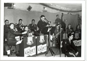 Captain Glenn Miller plays trombone in the Rhythmaires band at Maxwell Field, Dec. 24, 1942. The band played five times during Miller’s five weeks at Maxwell, culminating with the Christmas Eve concert. (Photo Source: U.S. Air Force, Public Domain) http://www.maxwell.af.mil/News/Display/Article/704372/glenn-miller/