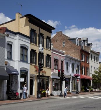 A row of historic buildings in pastel colors 