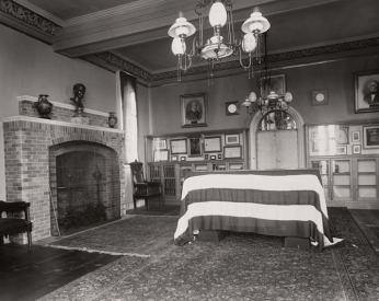 Smithson's body lying in the South Tower of the castle: his coffin is in the center of the room, draped in the American flag