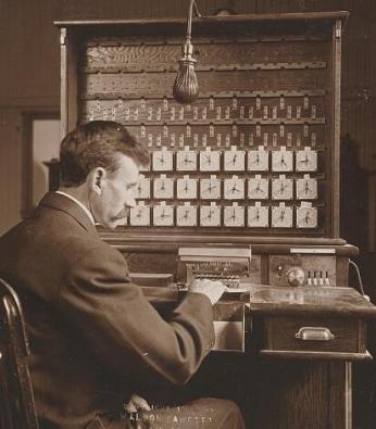 A census worker operating a Hollerith machine in 1908