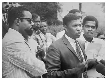 Faculty member and students pictured at a conference on the main yard at Howard University.