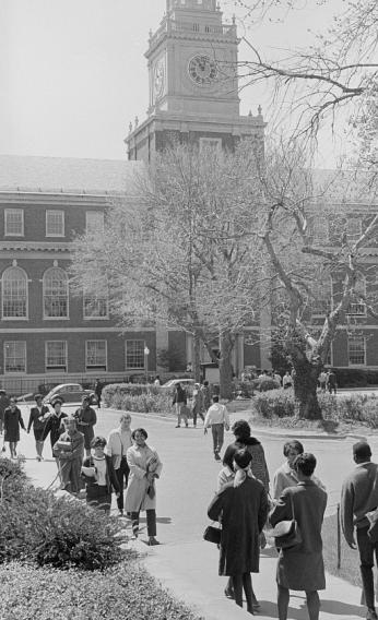 Students pictured walking in front of Founder's Library on the campus of Howard University.