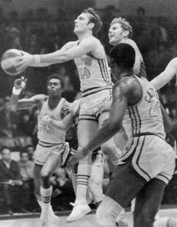 Rick Barry attempts a scoop shot while playing for Washington Caps in 1969. (Reprinted with permission of the DC Public Library, Star Collection, © Washington Post.)