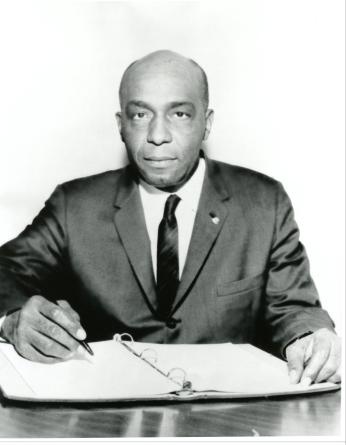 Sumuel Tucker sitting at his desk. (Source: Alexandria Black History Museum)