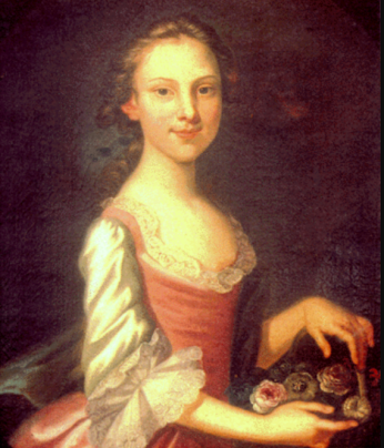 Portrait of a young woman in a pink dress with a basket of flowers.
