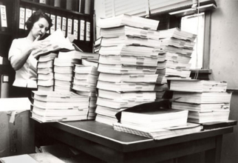 Chemist Lee Geismar, who was part of the team that reviewed the new drug application for thalidomide in the early 1960s, is shown some years later poring over several volumes of another application