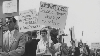 People protest for gay rights with picket signs outside the pentagon