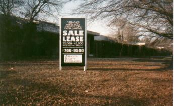 1946 Isaac Newton Square with a for sale sign in front