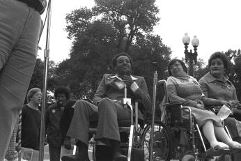 Brad Lomax, center, next to the activist Judy Heumann at a rally in 1977 at Lafayette Square in Washington. (Photo by HolLynn D'Lil) Brad Lomax, center, next to the activist Judy Heumann at a rally in 1977 at Lafayette Square in Washington. (Photo by HolLynn D'Lil)
