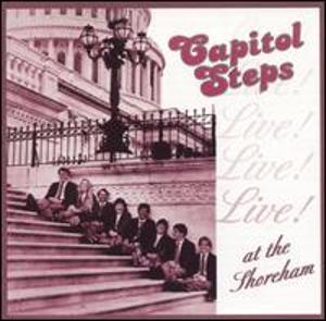 Album Cover "The Capitol Steps-Live! at the Shoreham" Album Cover with people sitting on the Steps of the Capitol. The title of the album is "The Capitol Steps-Live! at the Shoreham"