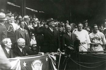 President Franklin D. Roosevelt, shown here in throwing out the ceremonial first pitch at Griffith Stadium in 1934, recommended that baseball continue during World War II. However, teams were expected to curtail travel and conduct spring training close to home. (Photo source: National Archives)