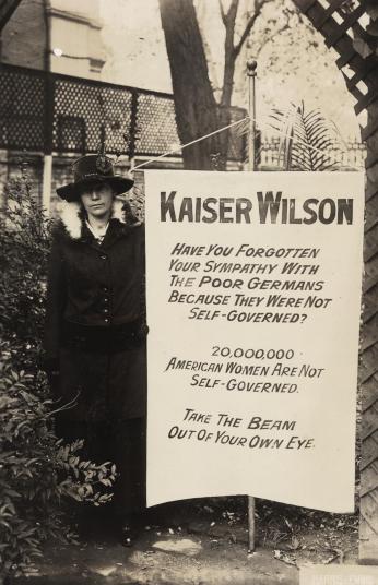Virginia Arnold holding Kaiser Wilson banner, 1917. (Source: Library of Congress)