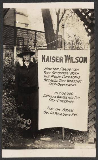 Virginia Arnold holding Kaiser Wilson banner, 1917. (Source: Library of Congress)