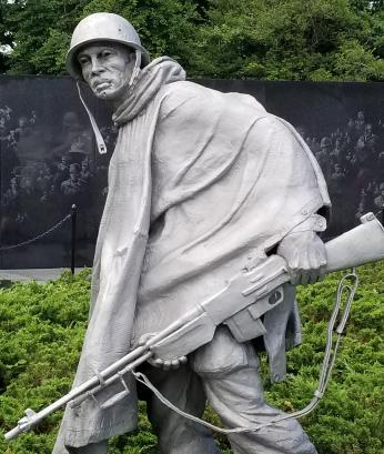 The statues were designed by Vermont sculptor Frank Gaylord, and situated so that they would be reflected in the memorial's wall.