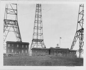 Image of the ground level buildings at Arlington Radio Station Image of the ground level buildings at Arlington Radio Station, surrounded by the radio towers.