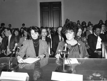 Congresswoman Nancy Pelosi and Elizabeth Taylor testifying for HIV/AIDS Funding in 1990. (Photo source: Nancy Pelosi on Flickr) 