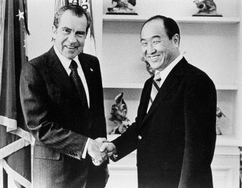 Richard Nixon shaking hands with Reverend Sun Myung Moon