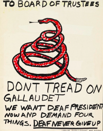 A white rectangular poster depicts a message handwritten by a Gallaudet student during the “Deaf President Now” protests. “To Board of Trustees” is written at the top of the poster followed by an image of a coiled red snake. Below the snake is a statement in capital letters that reads “Don’t tread on Gallaudet we want a deaf presidents now and demand four things. Deaf never give up.” 