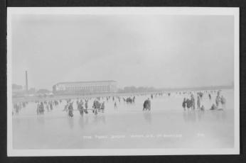 Black and white photo of people ice skating and walking on the Tidal Basin