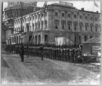 Union soldiers billeted at the Capitol practice drills in 1861. (Photo source: Library of Congress)