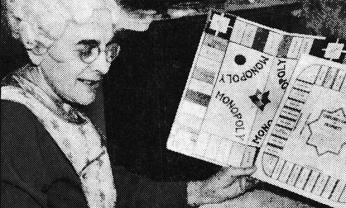 Elizabeth Magie comparing a copy of “Monopoly” to “The Landlord’s Game.” (Image source: “Designed to Teach,” Evening Star, January 28, 1936.)