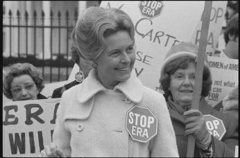Phyllis Schlafly, wearing a "STOP ERA" badge, protesting the Equal Rights Amendment in front of the White House in February 1977.