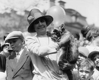 First Lady Grace Coolidge holds Rebecca the Raccoon