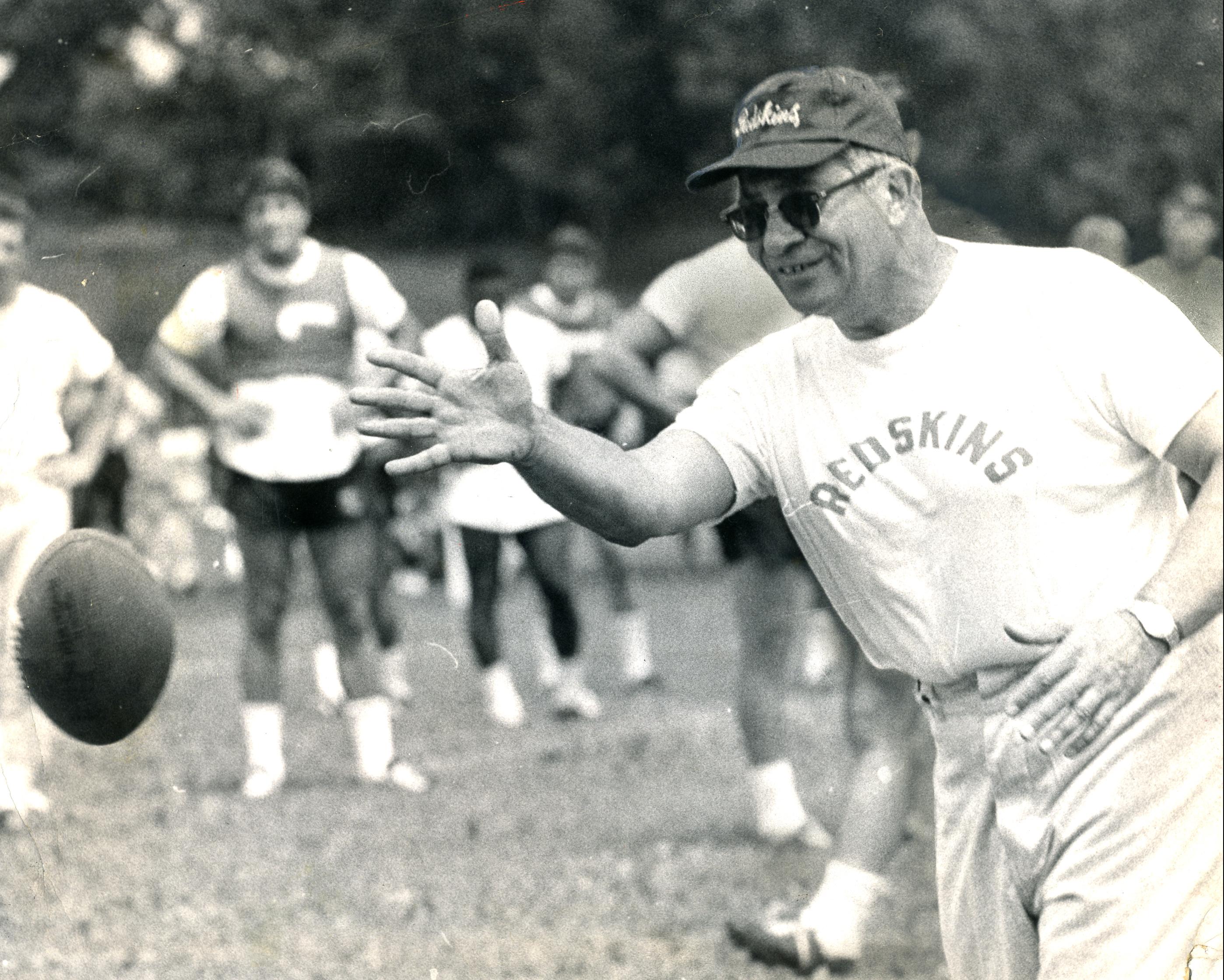 Vince Lombardi tosses a football in a practice during the 1969 season. (Reprinted with permission of the DC Public Library, Star Collection, © Washington Post.)