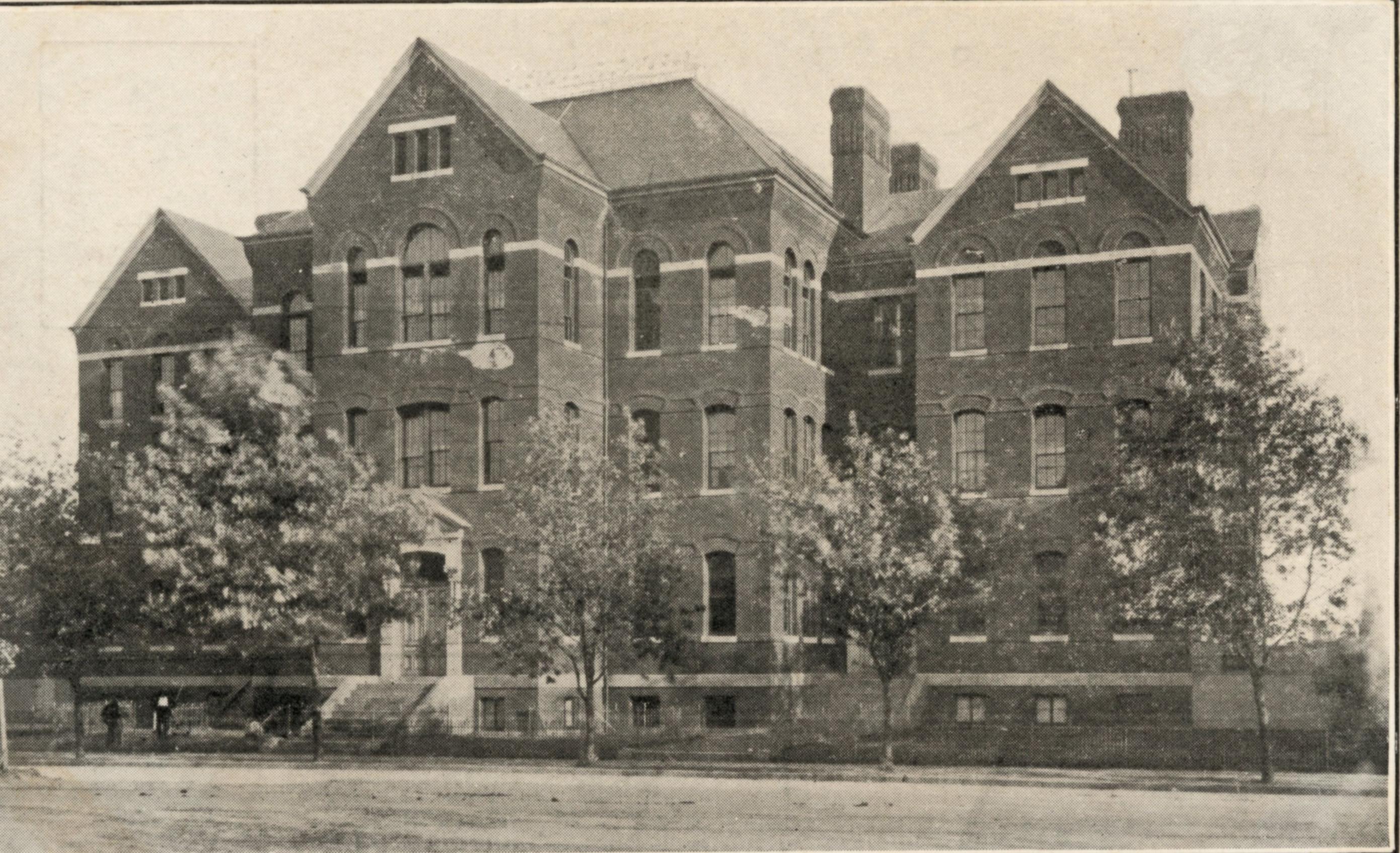 Entrance view image of high storied M Street School building photographed 1906.