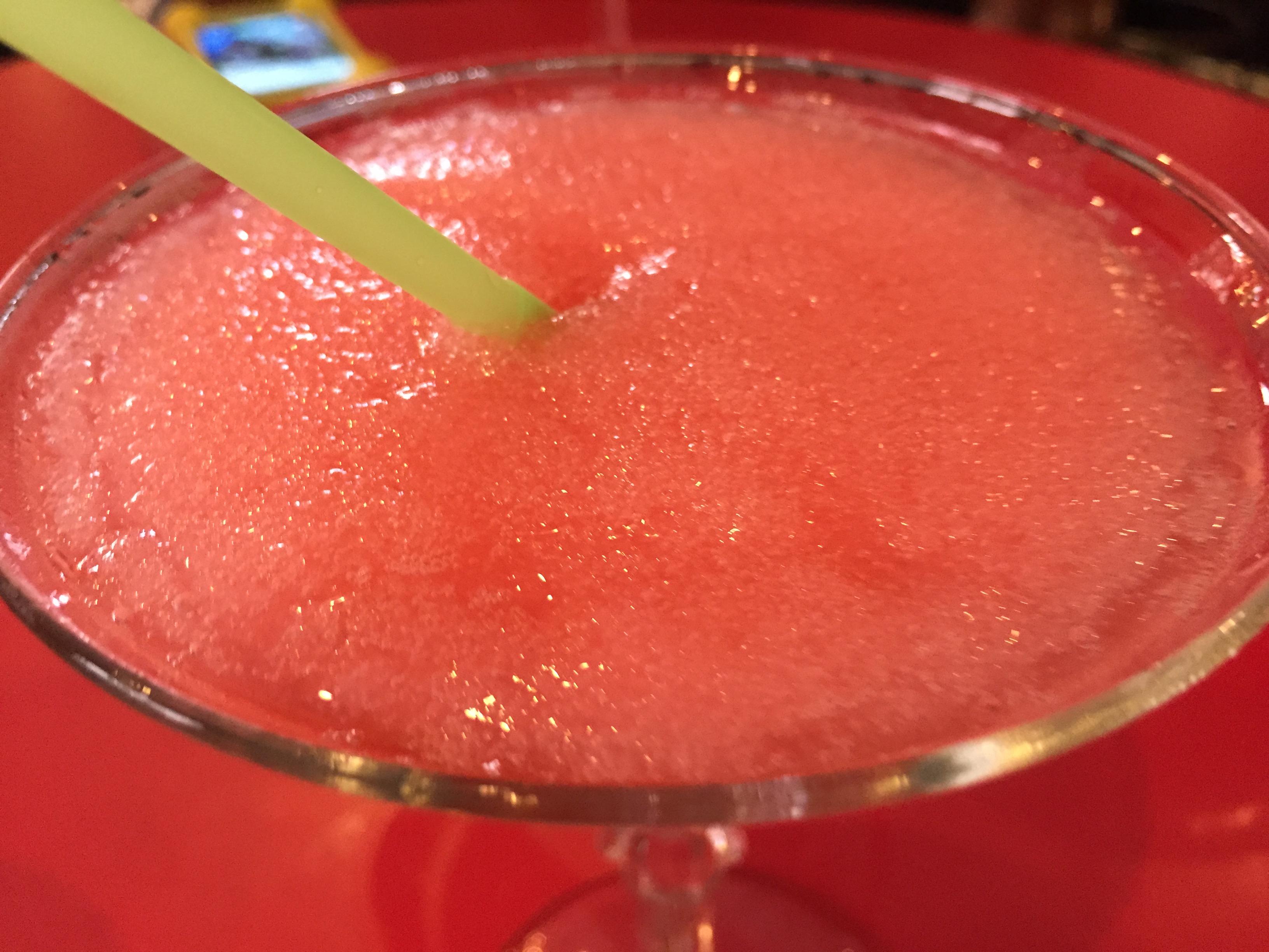 Closeup of red frozen daquiri in glass with straw. (Source: Flickr user vxla, licensed by CC BY-NC 2.0)