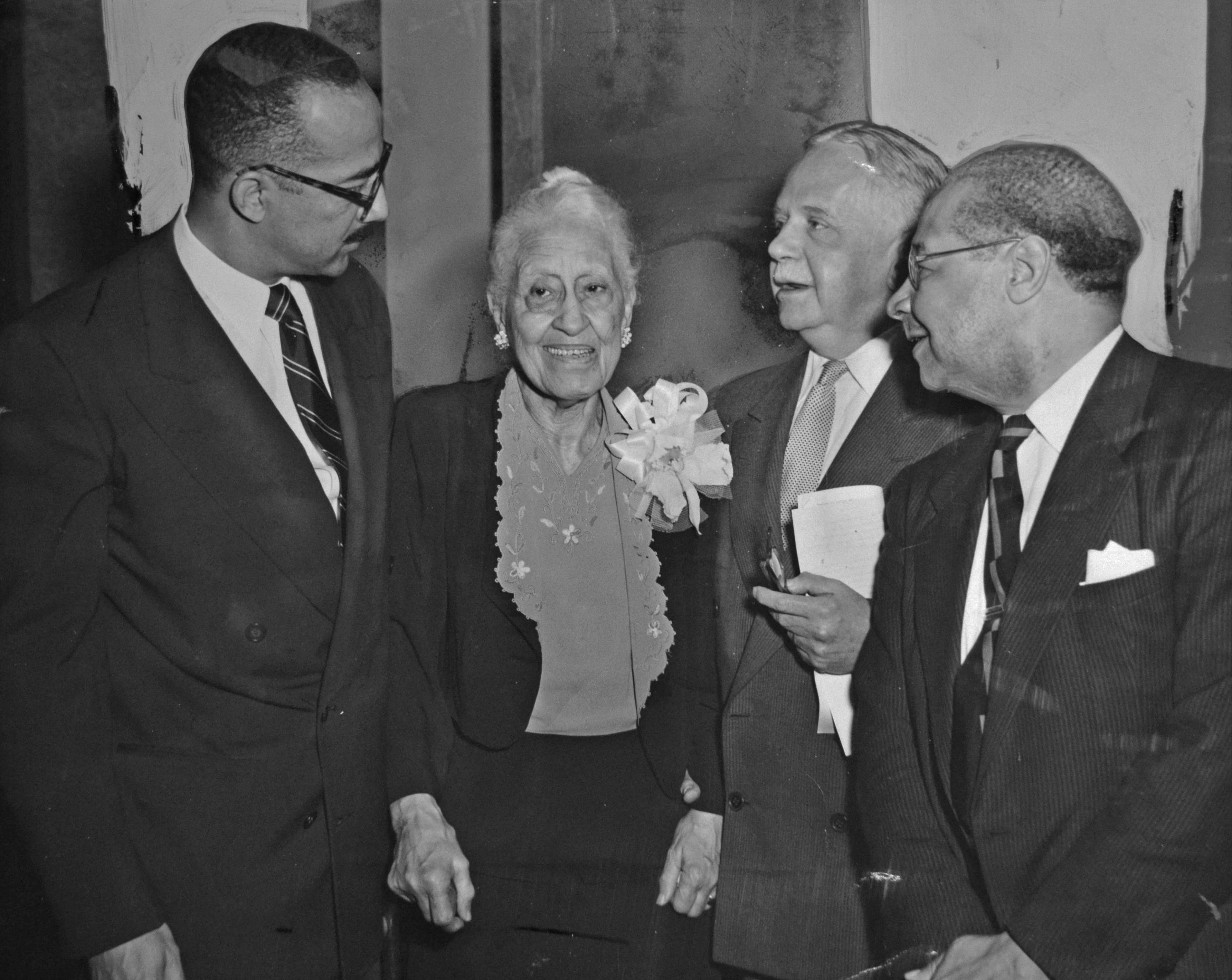 Mary Church Terrell stands with three African American men in 1953. (Reprinted with permission of the DC Public Library, Star Collection, © Washington Post.)