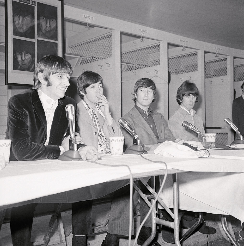 The Beatles hold a press conference in the Washington Senators locker room before their final D.C. concert on August 15, 1966 (Bettmann via Getty Images).