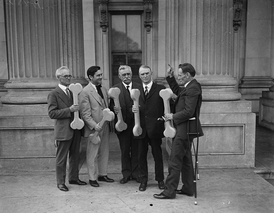 Group of men holding bones in support of Prohibition